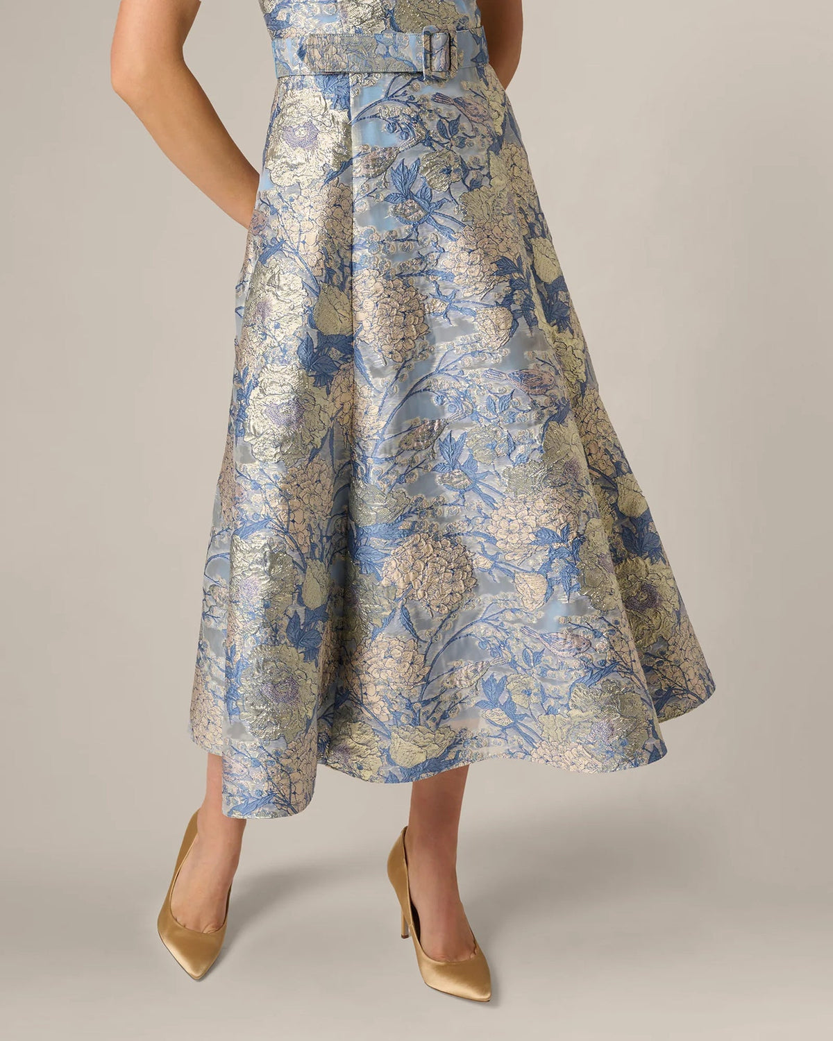 Blue floral A-line midi dress detail of waist belt and flared skirt hem