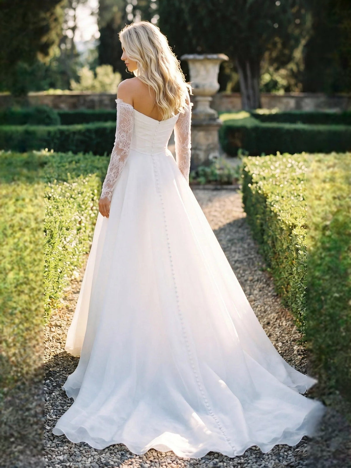 Ivory A-line wedding dress with lace long sleeves, sweetheart neckline, and full train