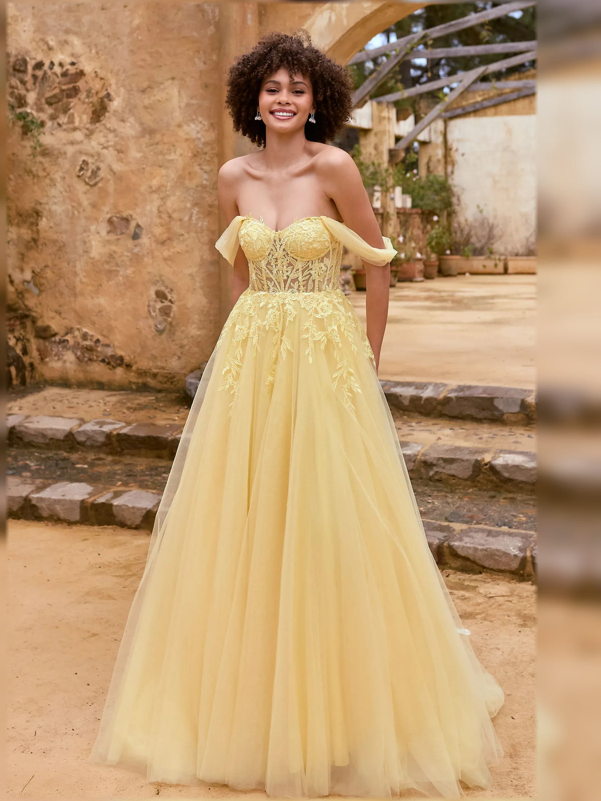 Pale lemon off-the-shoulder maxi dress with lace corset bodice, short sleeves, tulle skirt