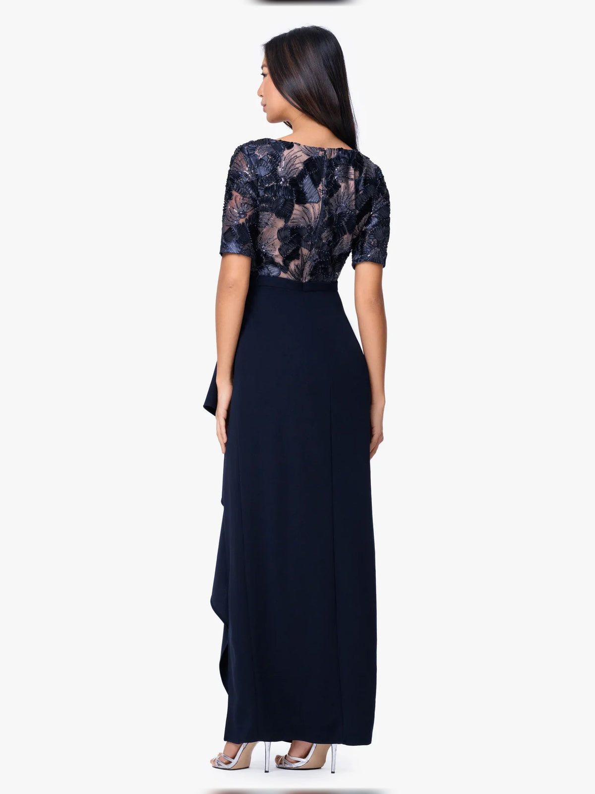 Dark navy floor-length dress with embroidered lace sleeves and side drape panel