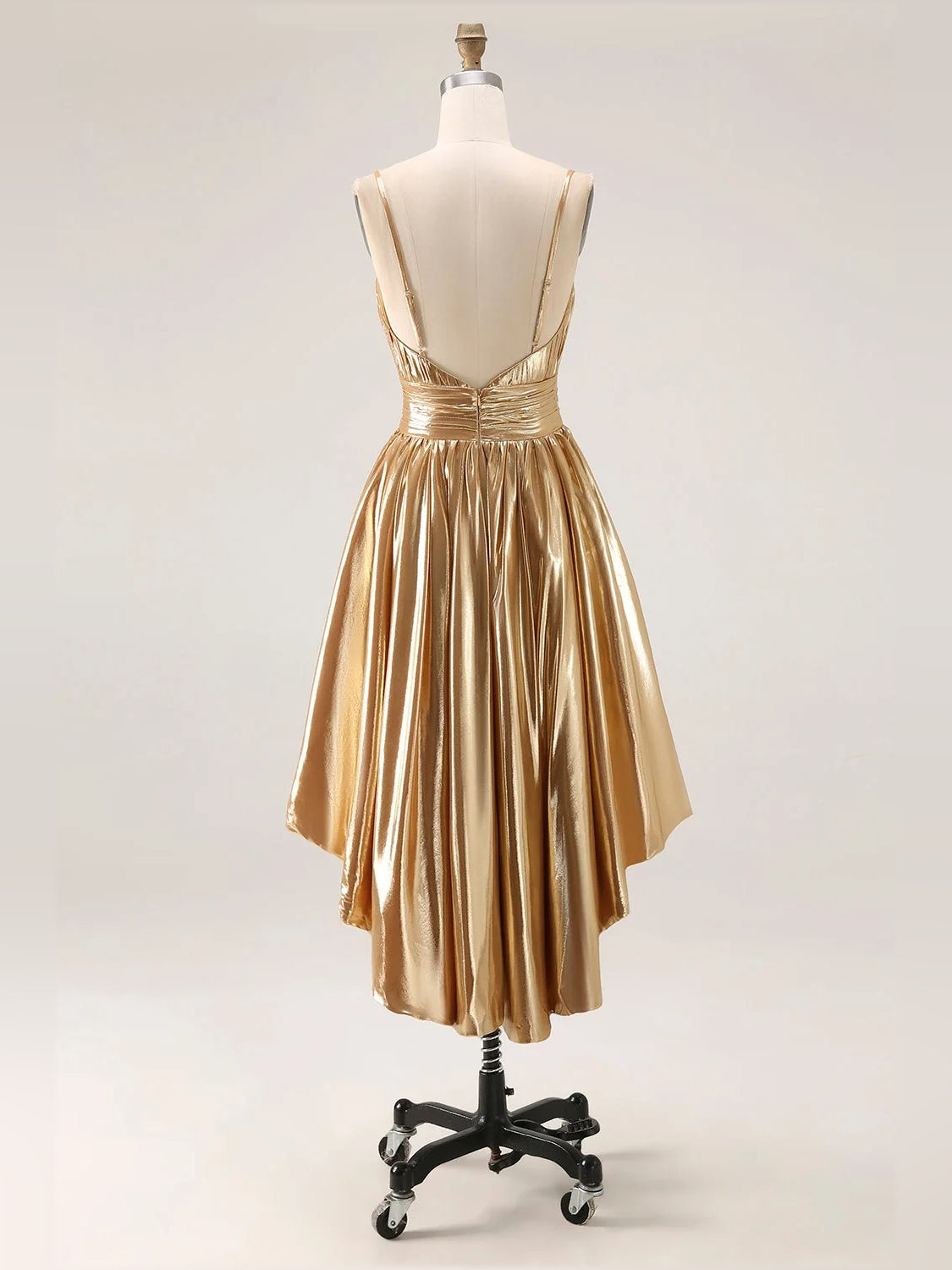Gold metallic high-low prom dress on mannequin, sleeveless with pleated layered skirt
