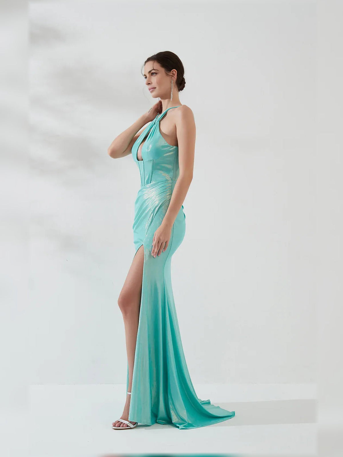Ice blue halter-neck corset formal dress with thigh slit, side view, floor-length