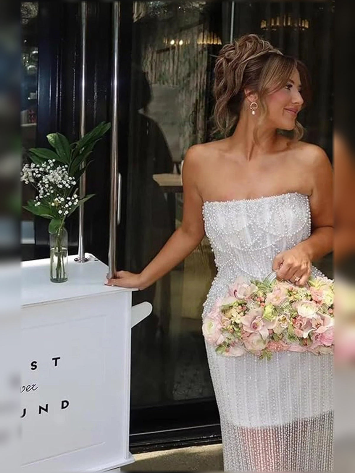 Ivory strapless formal gown with beaded corset bodice and sparkling fringe skirt