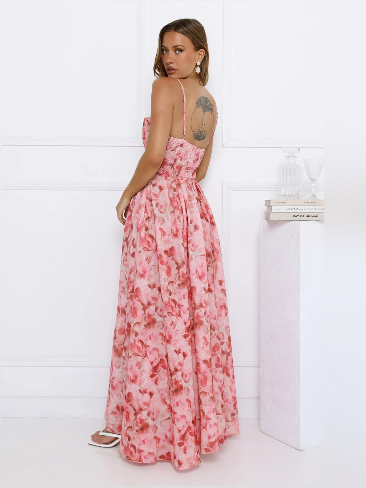 Pink floral midi formal dress back view with open back and flowing maxi skirt