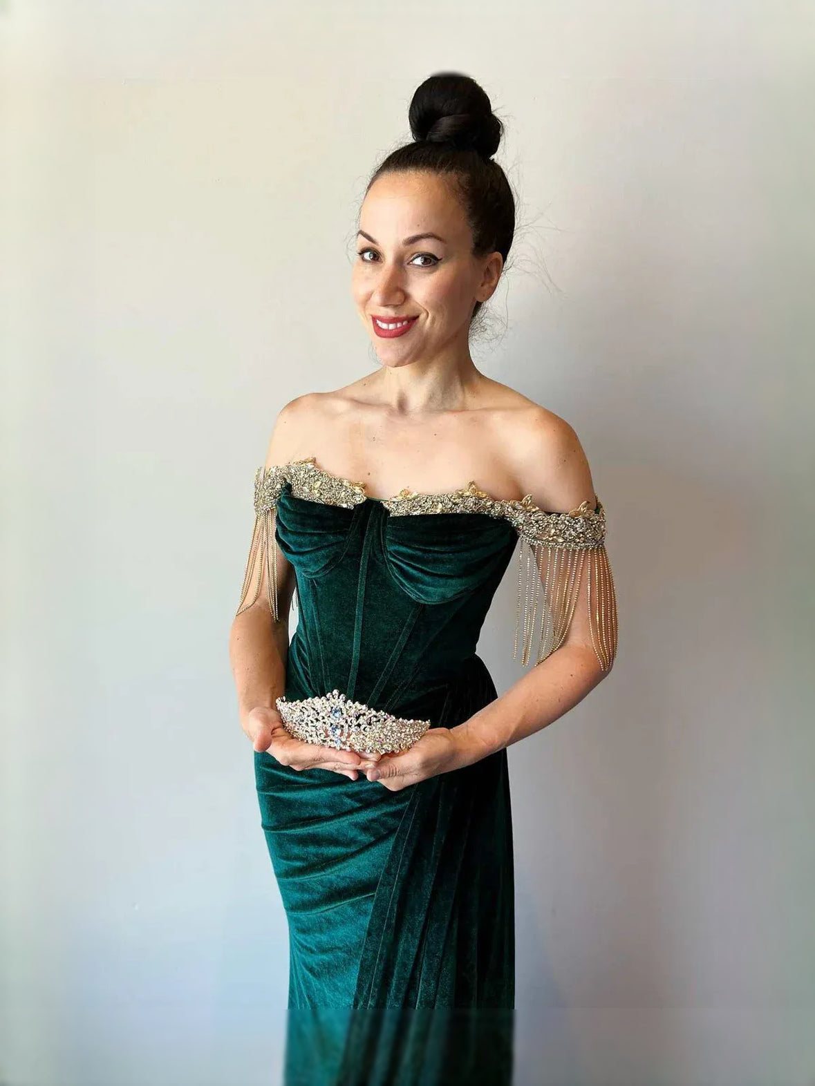 Emerald green velvet sweetheart prom dress with beaded off-shoulder detail and front slit