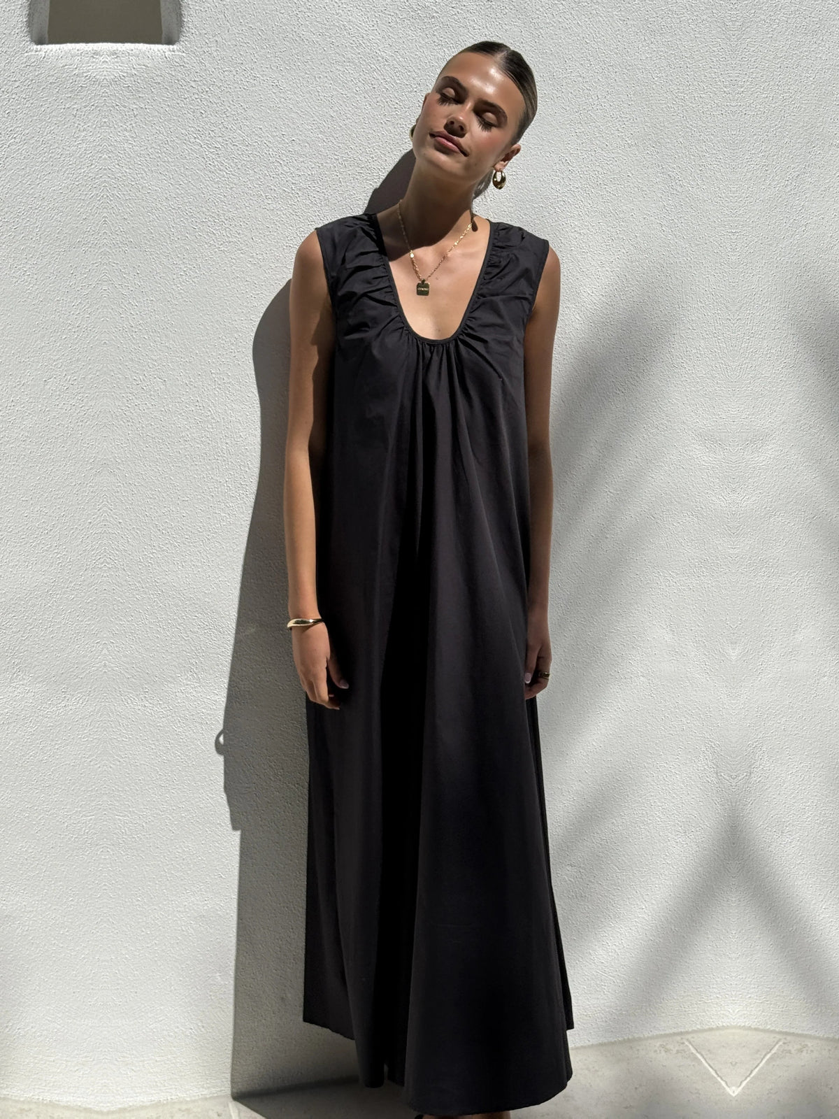 Black a-line maxi formal dress with halter neckline, alternate view showing the skirt
