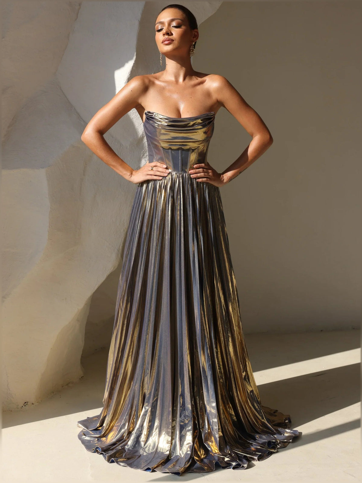 Gold metallic strapless corset formal dress with pleated vertical stripe skirt