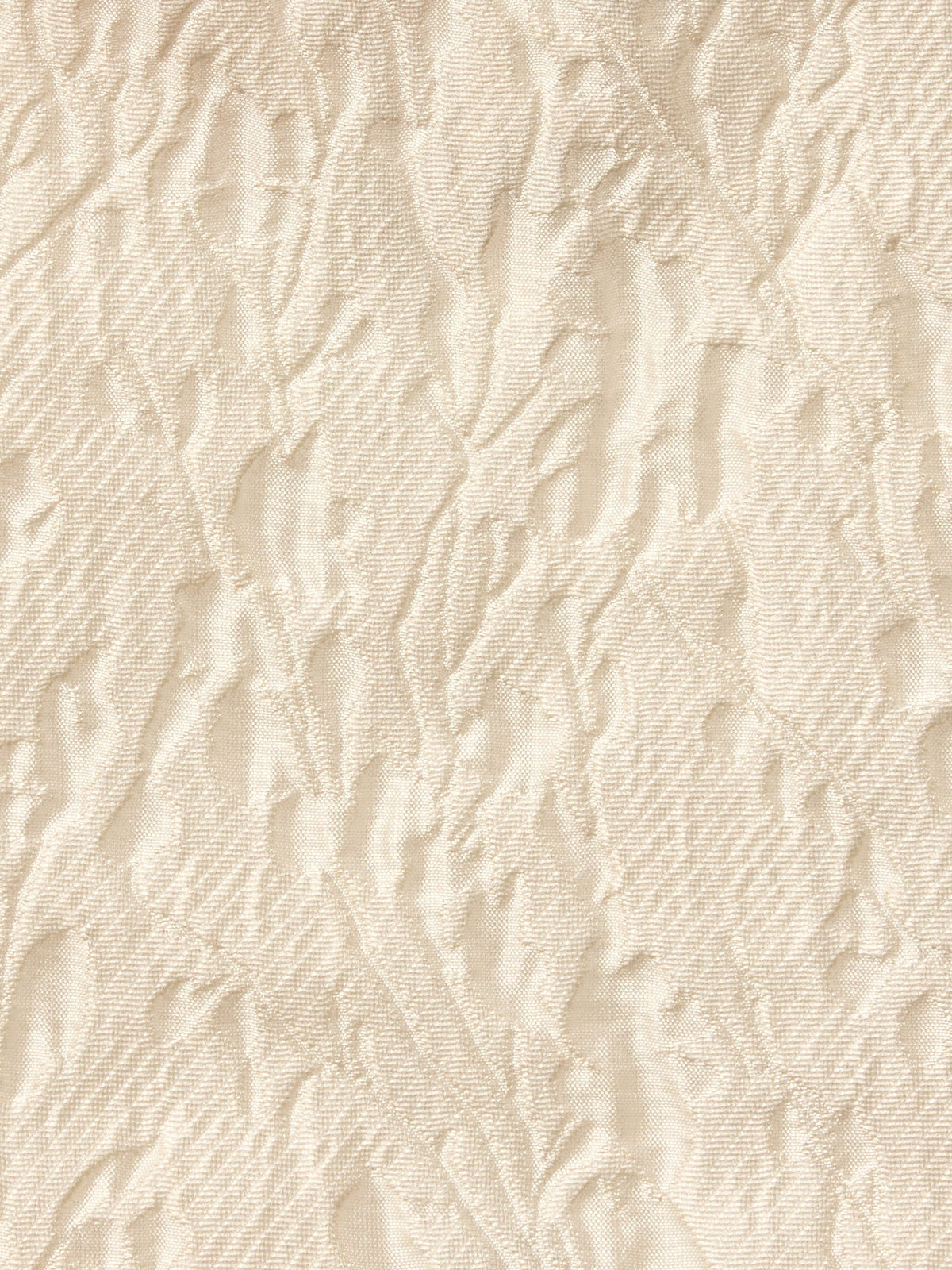 Cream textured fabric with raised pattern, close-up detail