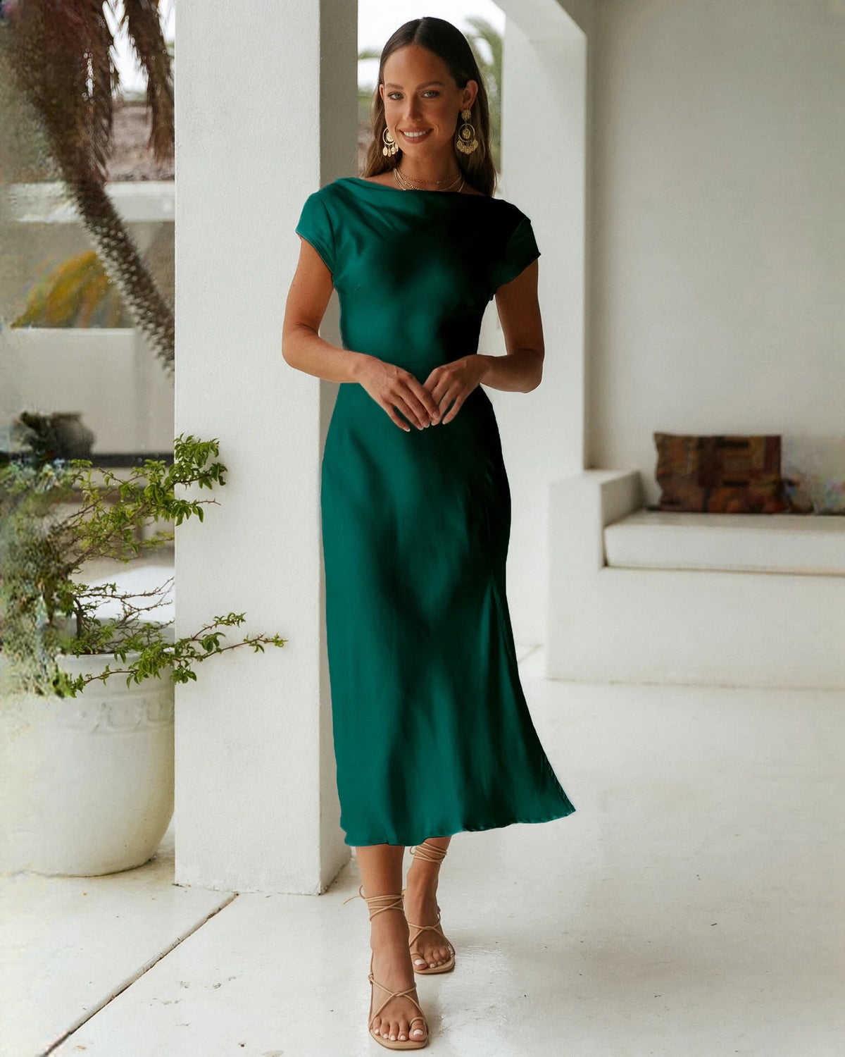 Emerald green satin sleeveless A-line bridesmaid dress with short cap sleeves