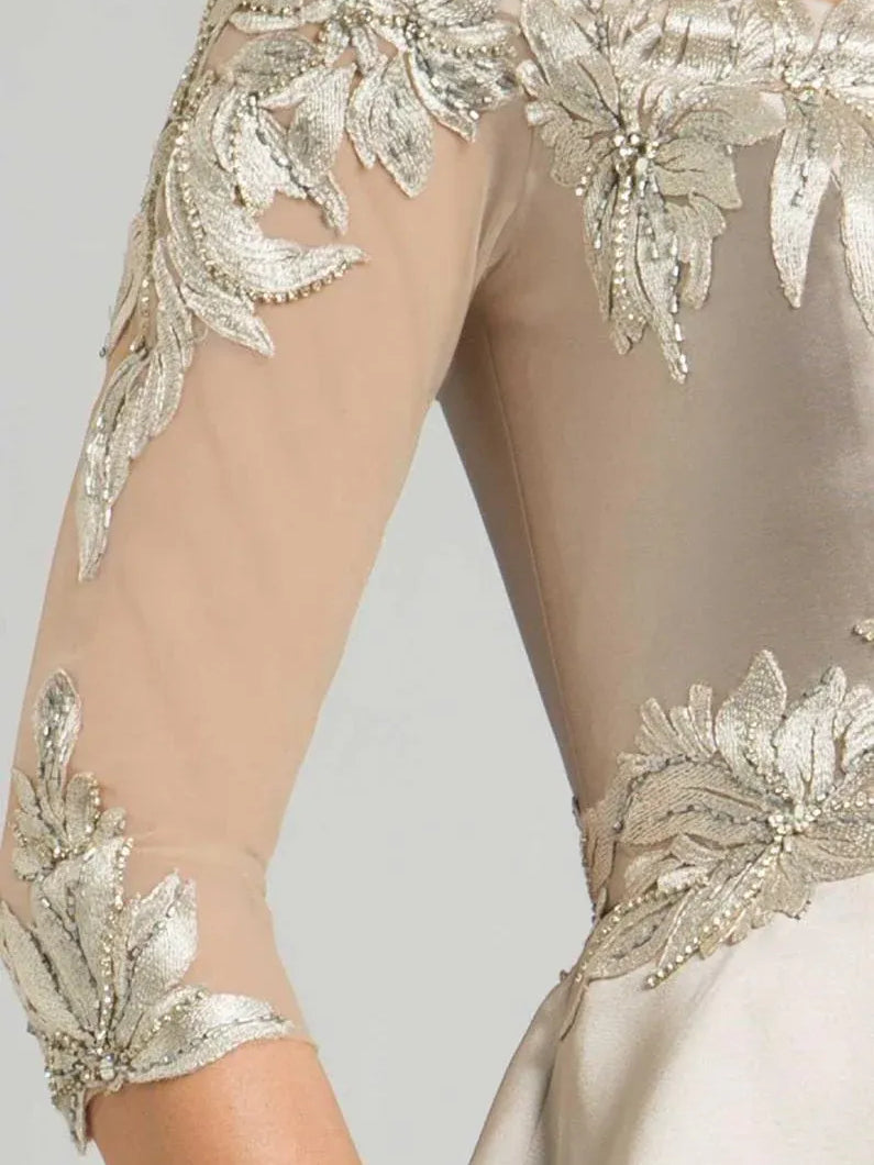 Champagne gown with silver beaded floral appliques along three-quarter sleeves