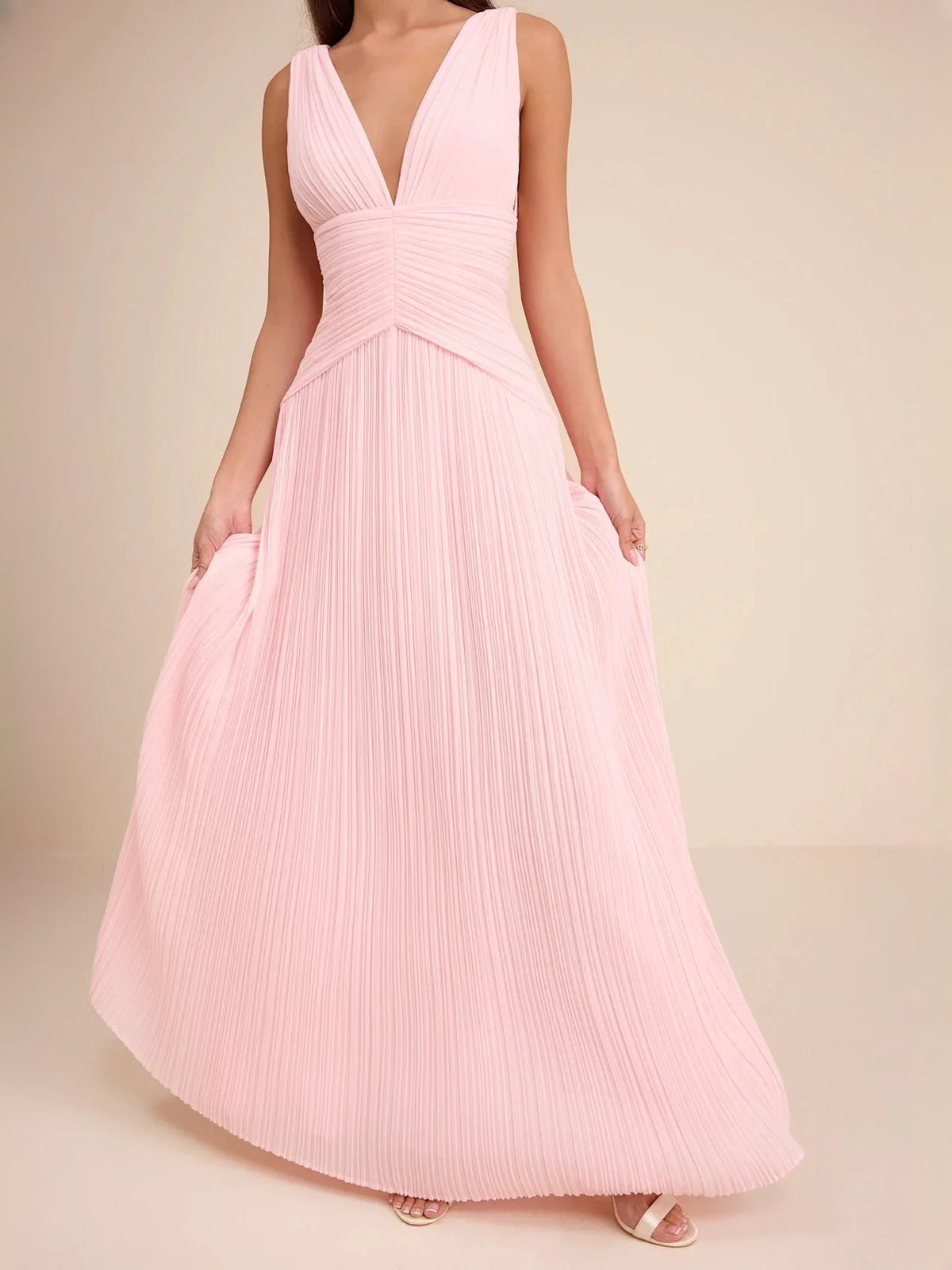 Light pink V-neck tiered maxi dress with ruched waist and pleated chiffon skirt