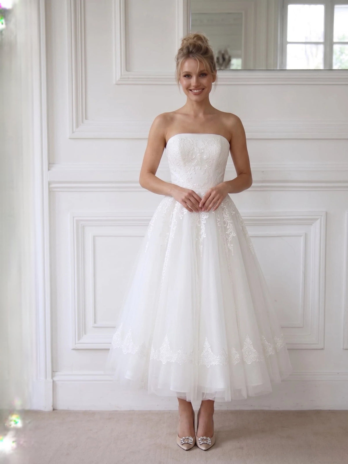 Ivory strapless A-line short wedding dress with lace detailing and layered tulle hem
