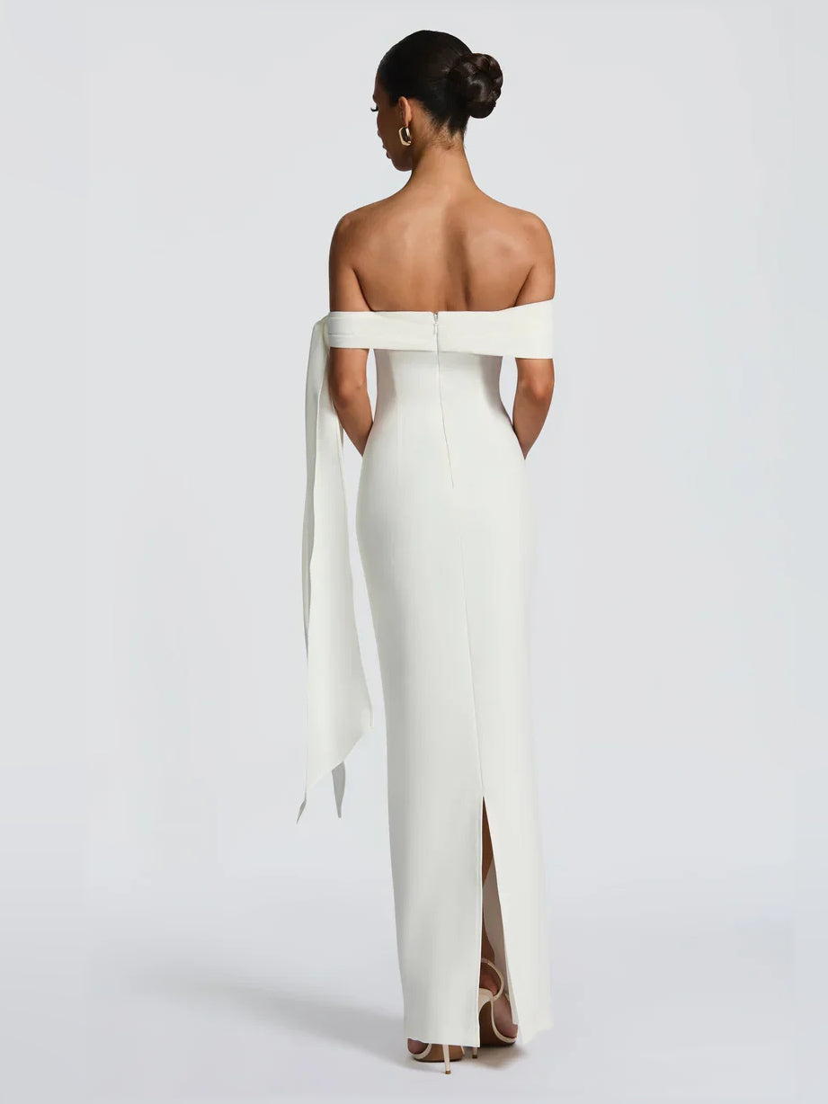 White off-shoulder sheath maxi dress, back view with draped bow-tie