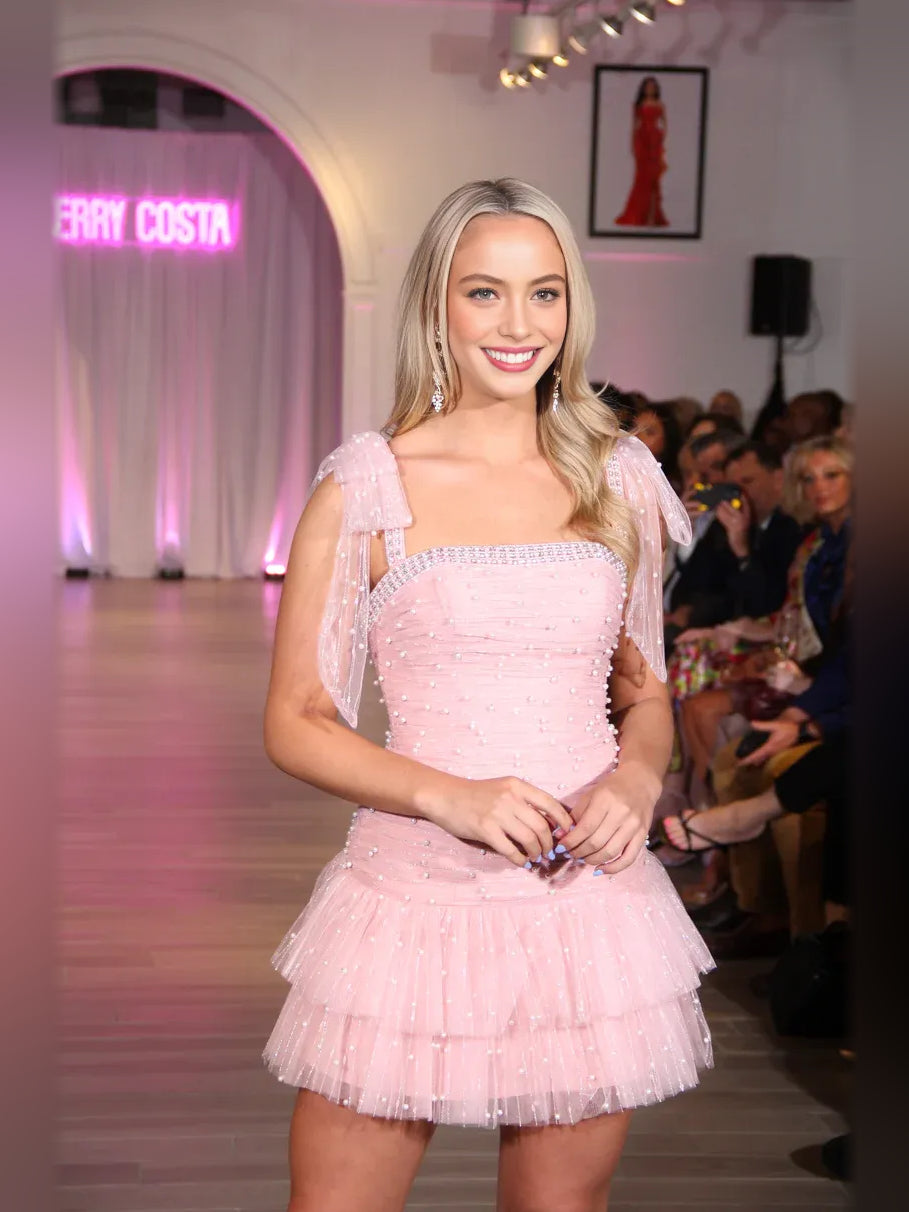 Blush pink mini tulle dress with straight neckline, sparkling bead bodice, tiered skirt
