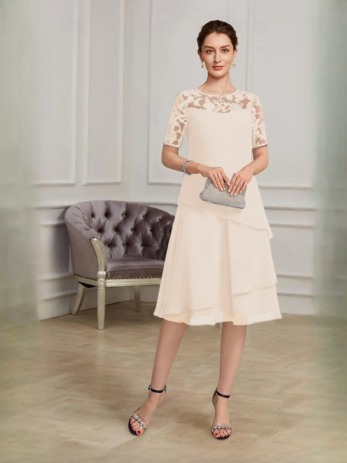 Ivory layered chiffon midi dress with lace short sleeves and tiered A-line skirt.