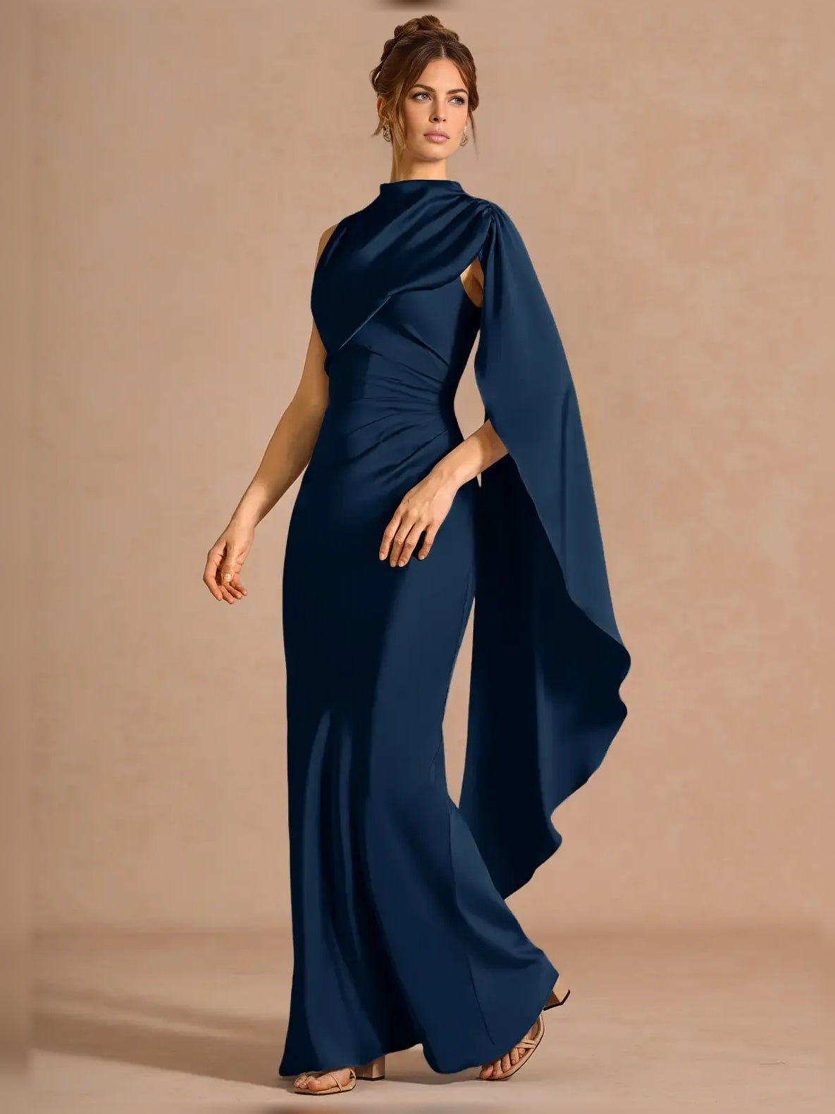 Navy one-shoulder formal dress with draped cape detail and flowing side drape