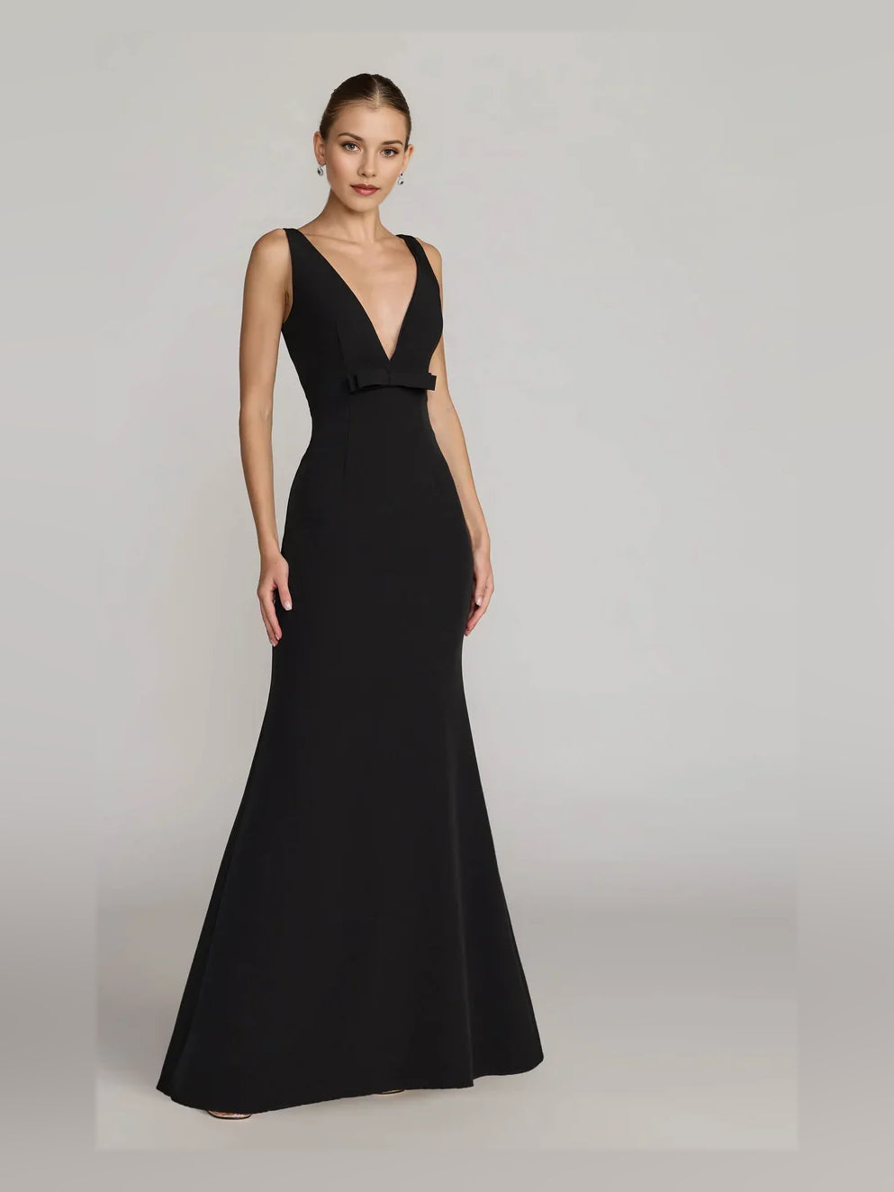 Black V-neck sleeveless mermaid formal dress, floor length with waist belt detail.