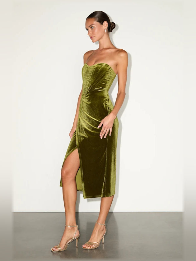 Olive velvet bustier midi formal dress, side view with asymmetrical slit hem