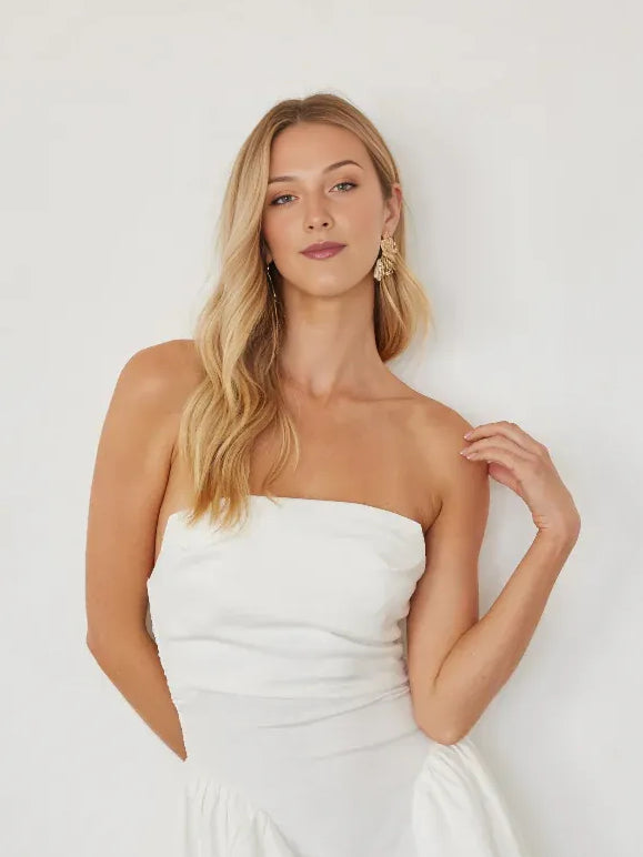 White strapless ruched bodice mini dress with gathered flounce skirt detail