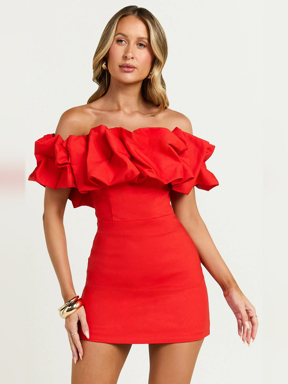 Red off-shoulder mini dress with dramatic layered ruffle sleeves and fitted waist