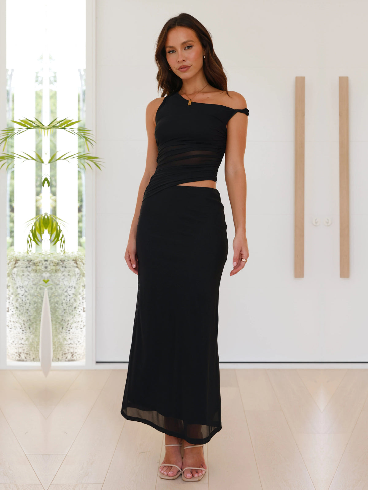 Black sheath maxi formal dress with cutout detail, alternate view showing the skirt