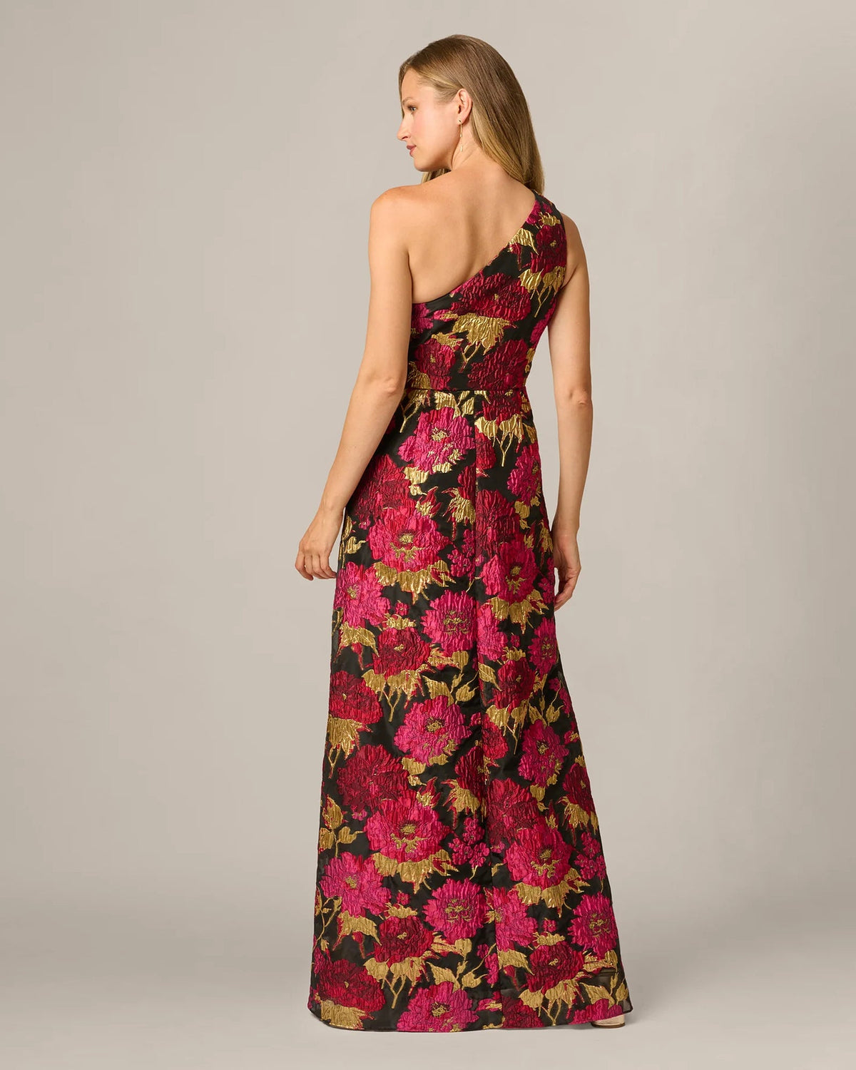 Floral one-shoulder A-line maxi dress shown from the back, dark base with pink multi print