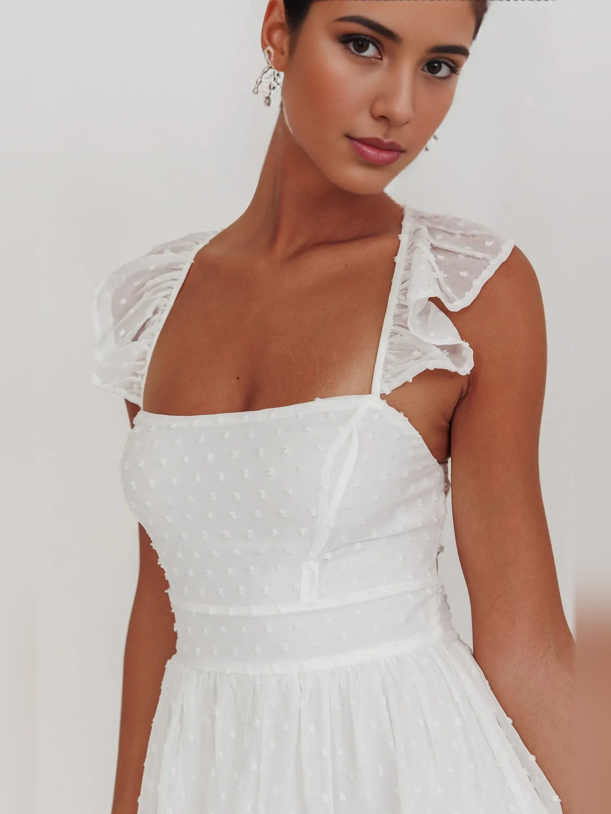White square-neck mini dress with ruffle-trim shoulder straps