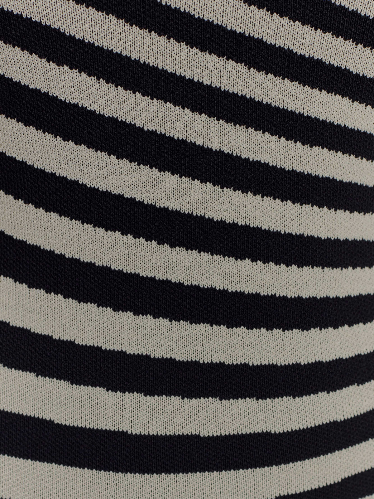 Black-and-white striped knit fabric swatch with wavy horizontal stripe pattern