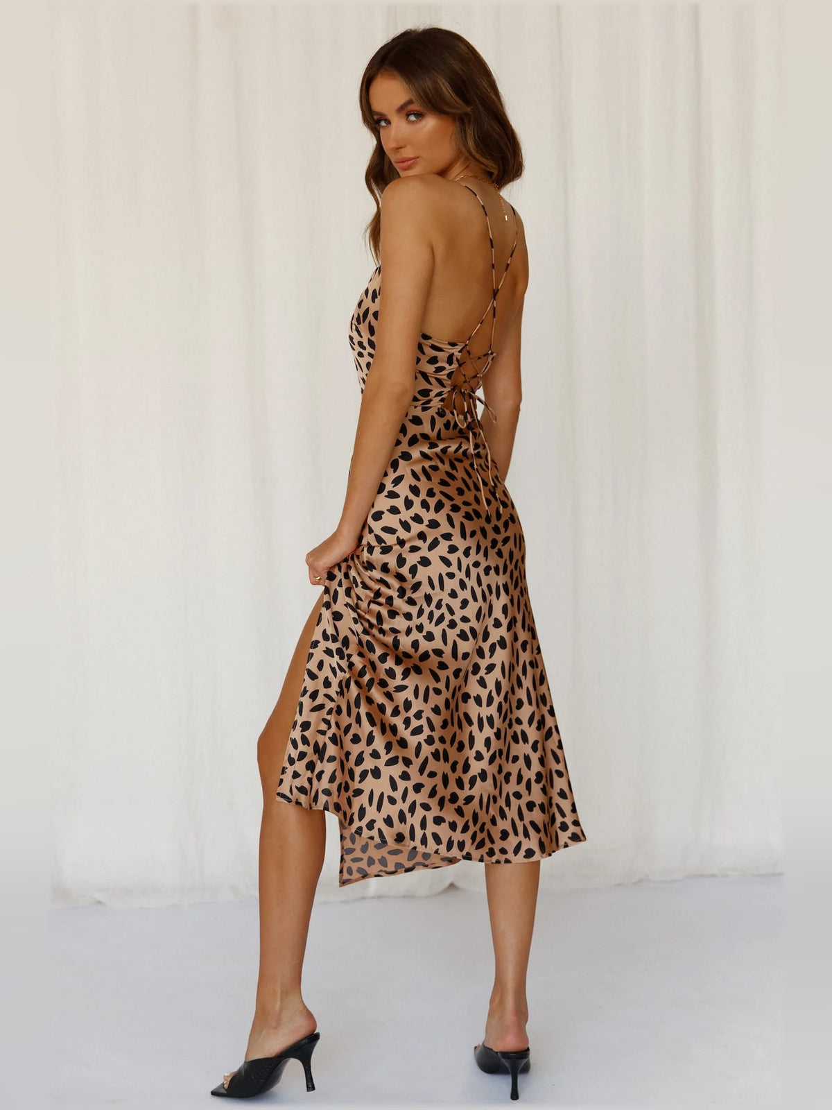 Tan leopard-print midi dress, open-back spaghetti straps, fitted skirt with side slit