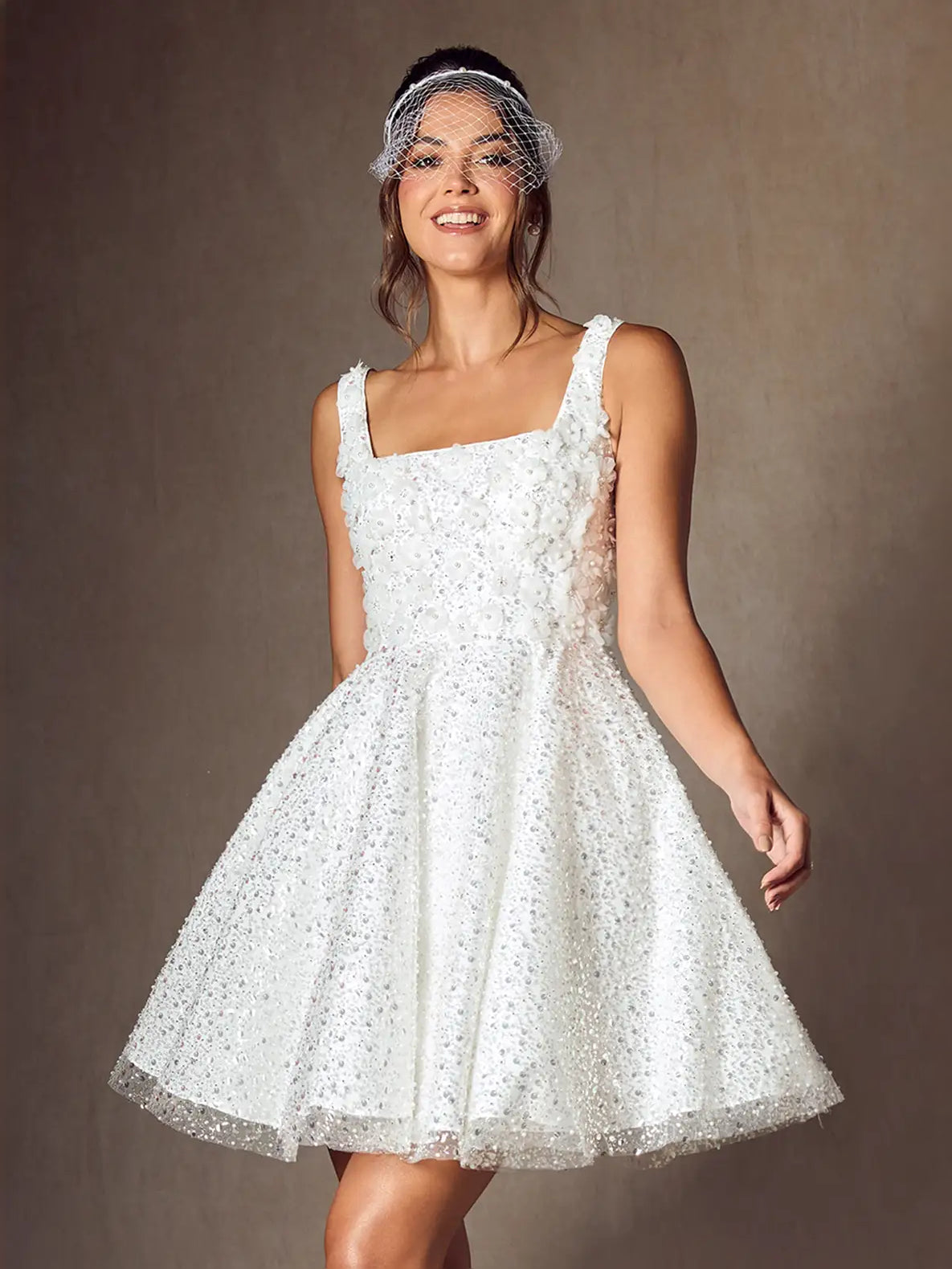White square-neck A-line mini wedding dress with glittery bodice and flared hem