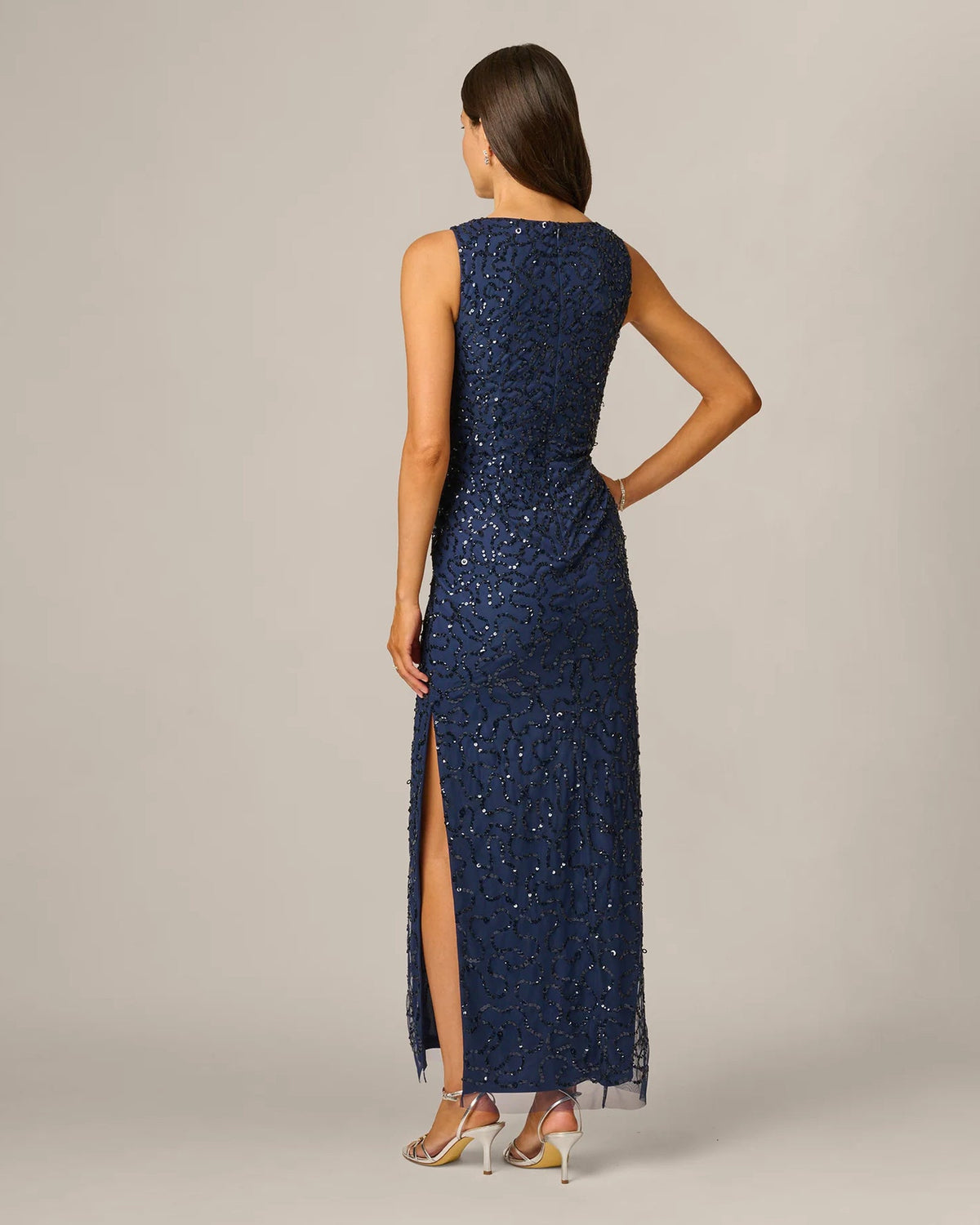 Navy sequin spaghetti-strap maxi dress, back view with side slit