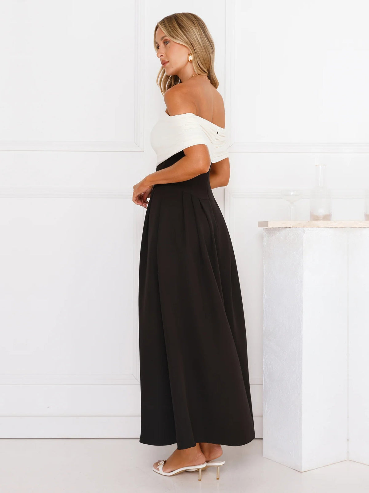 Black a-line maxi formal dress with off-the-shoulder neckline, alternate view showing the skirt