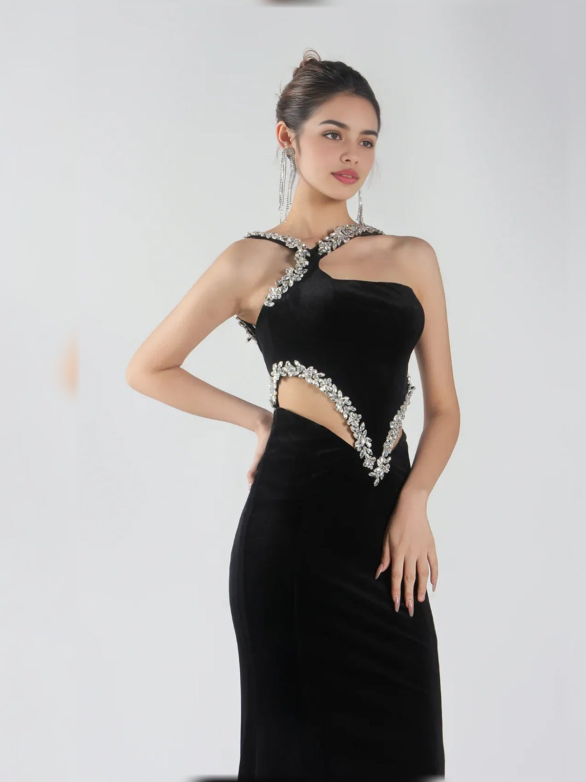 Black halter neck formal dress with asymmetric V cutout and sparkling silver beadwork