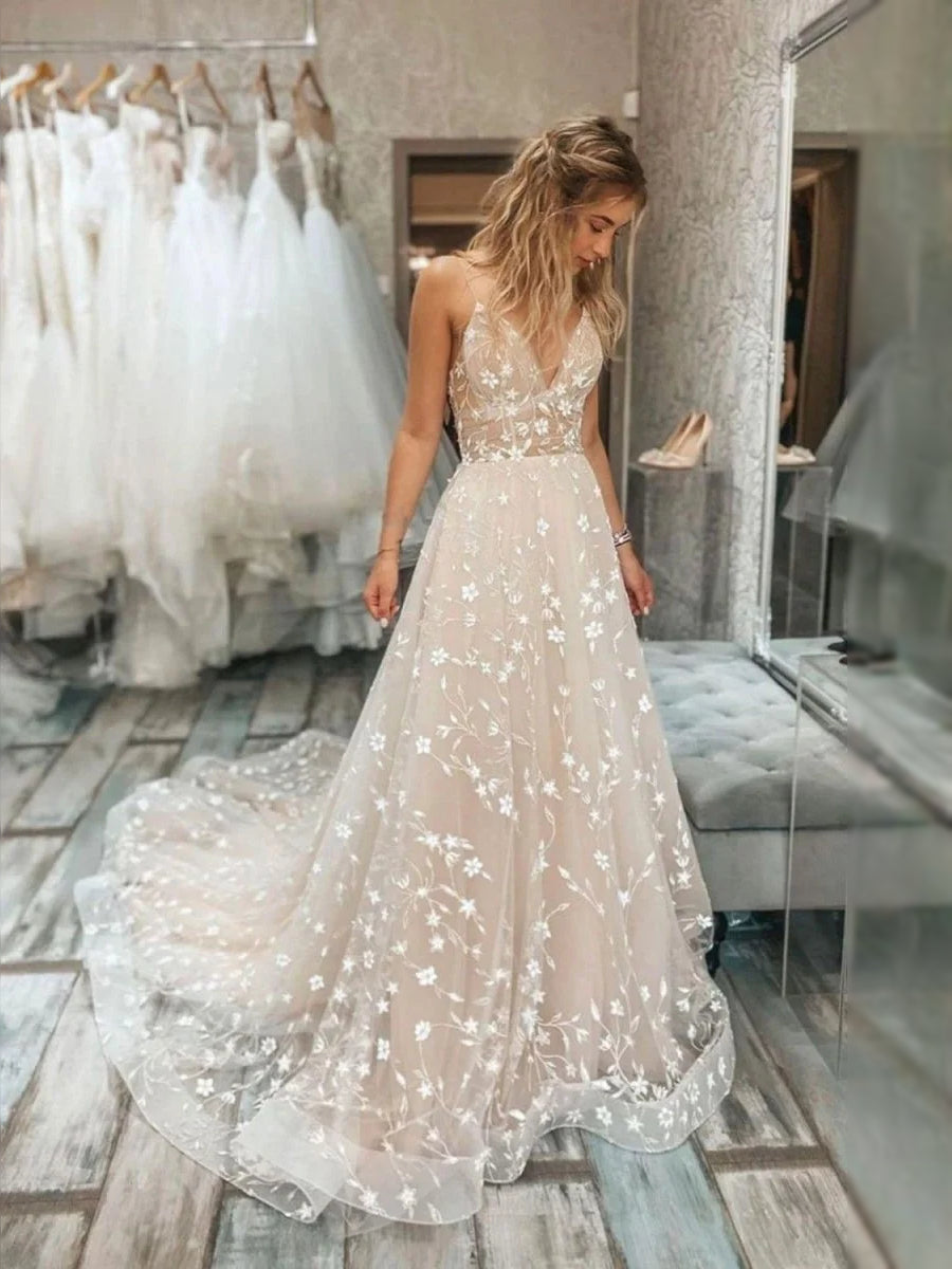 Champagne tulle sleeveless A-line gown with V-neck and scattered floral appliques