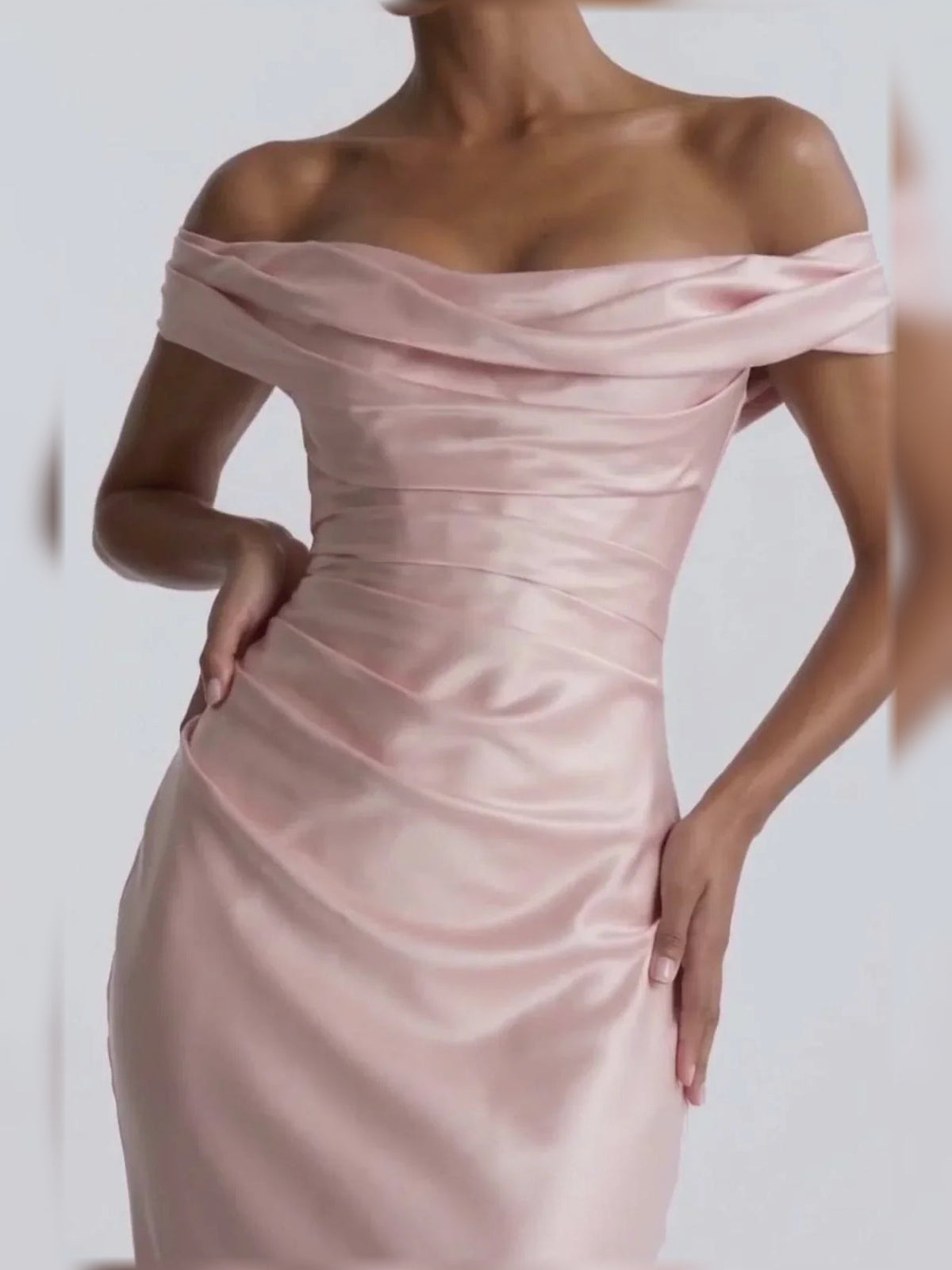 Close-up of off-shoulder satin corset formal dress, blush pink, ruched bodice detail