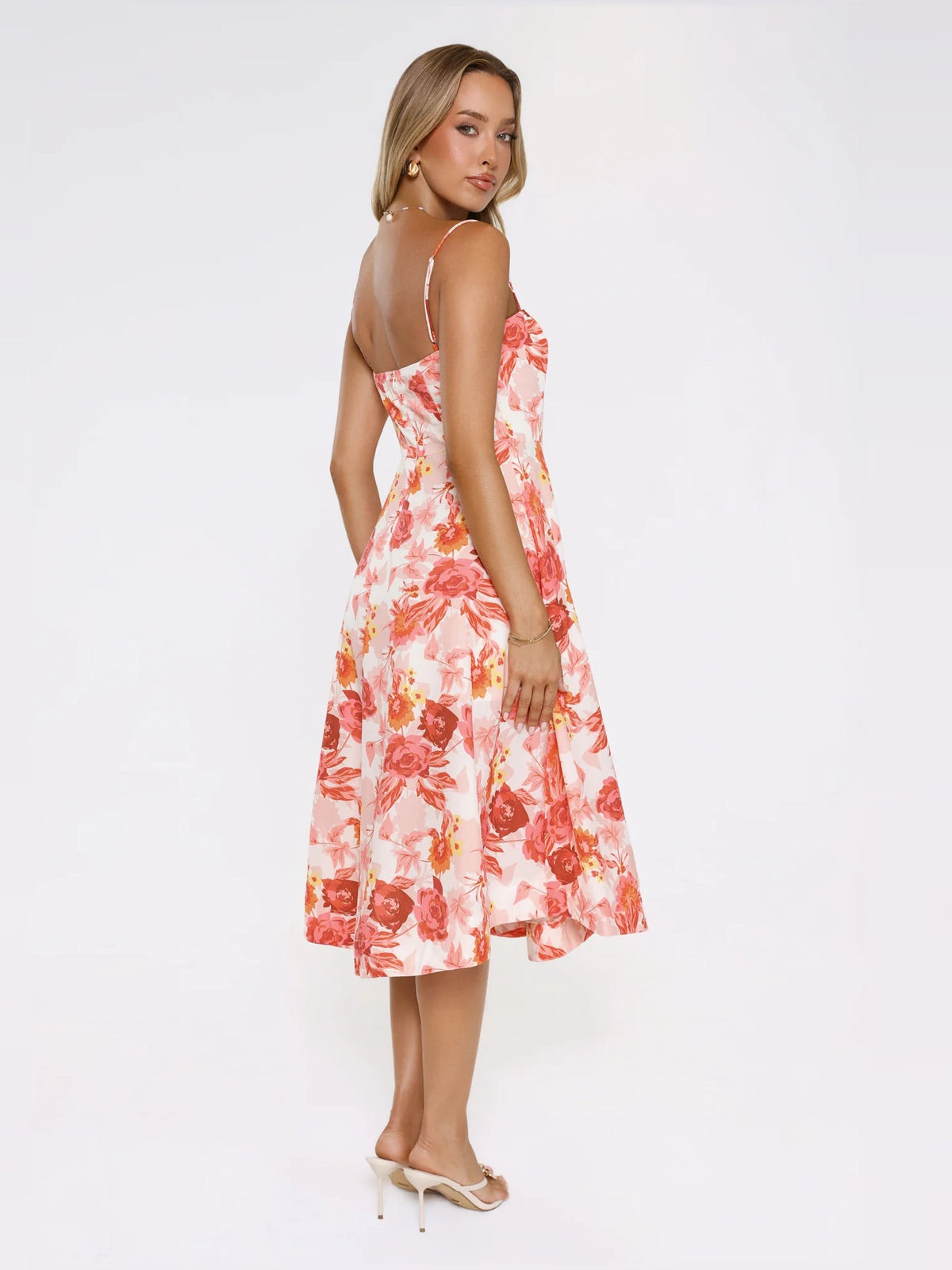 Floral midi formal dress, side view with spaghetti straps and a flared midi skirt