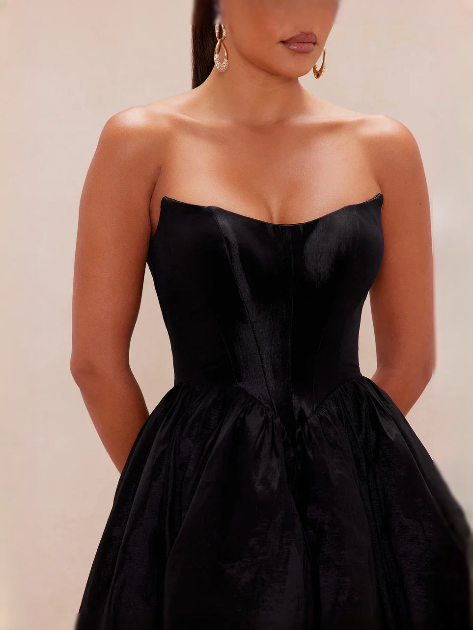Black strapless corset bodice with gathered waist on satin prom dress