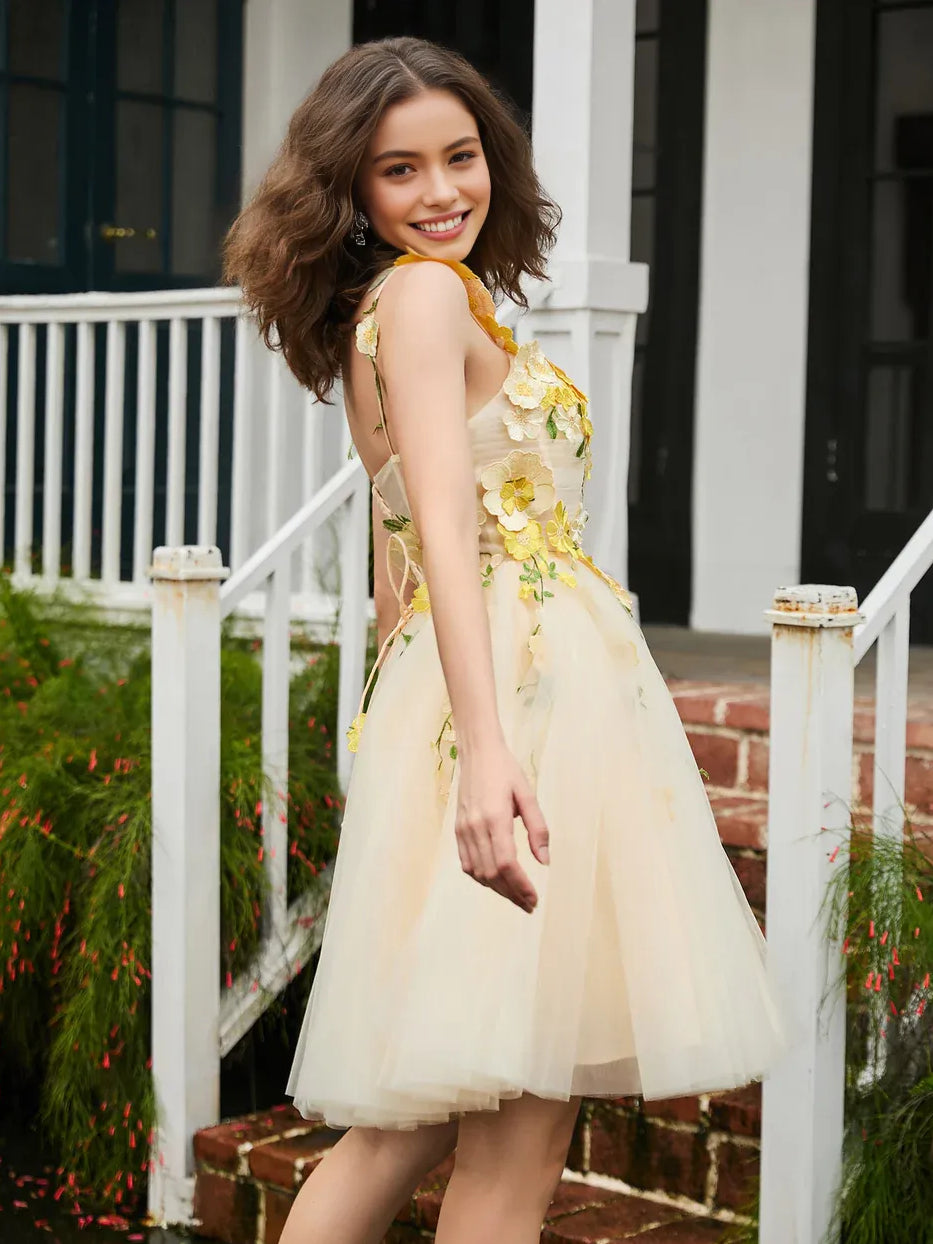 Pale lemon A-line tulle homecoming dress with layered floral appliques and thin straps