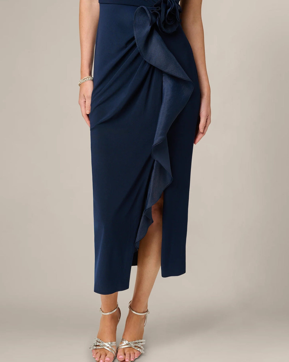 Midnight blue sleeveless maxi dress with layered front ruffle and asymmetrical slit