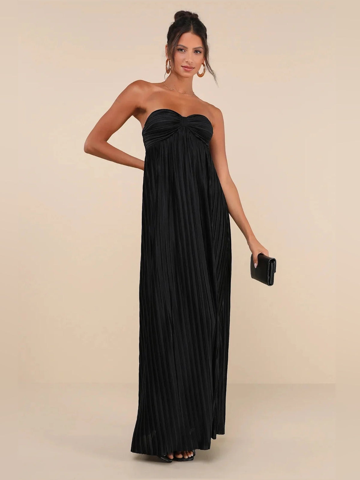Black strapless satin maxi dress with gathered sweetheart bodice and pleated drape