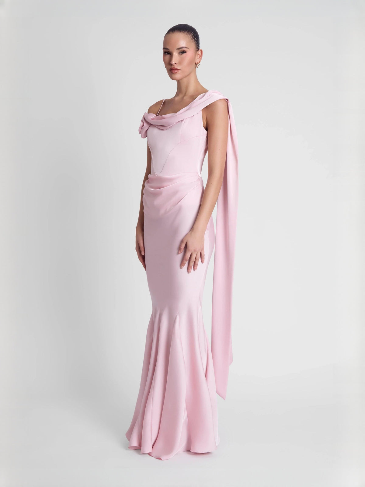 Pink fitted mermaid floor-length dress with side drape and rosette accent at shoulder