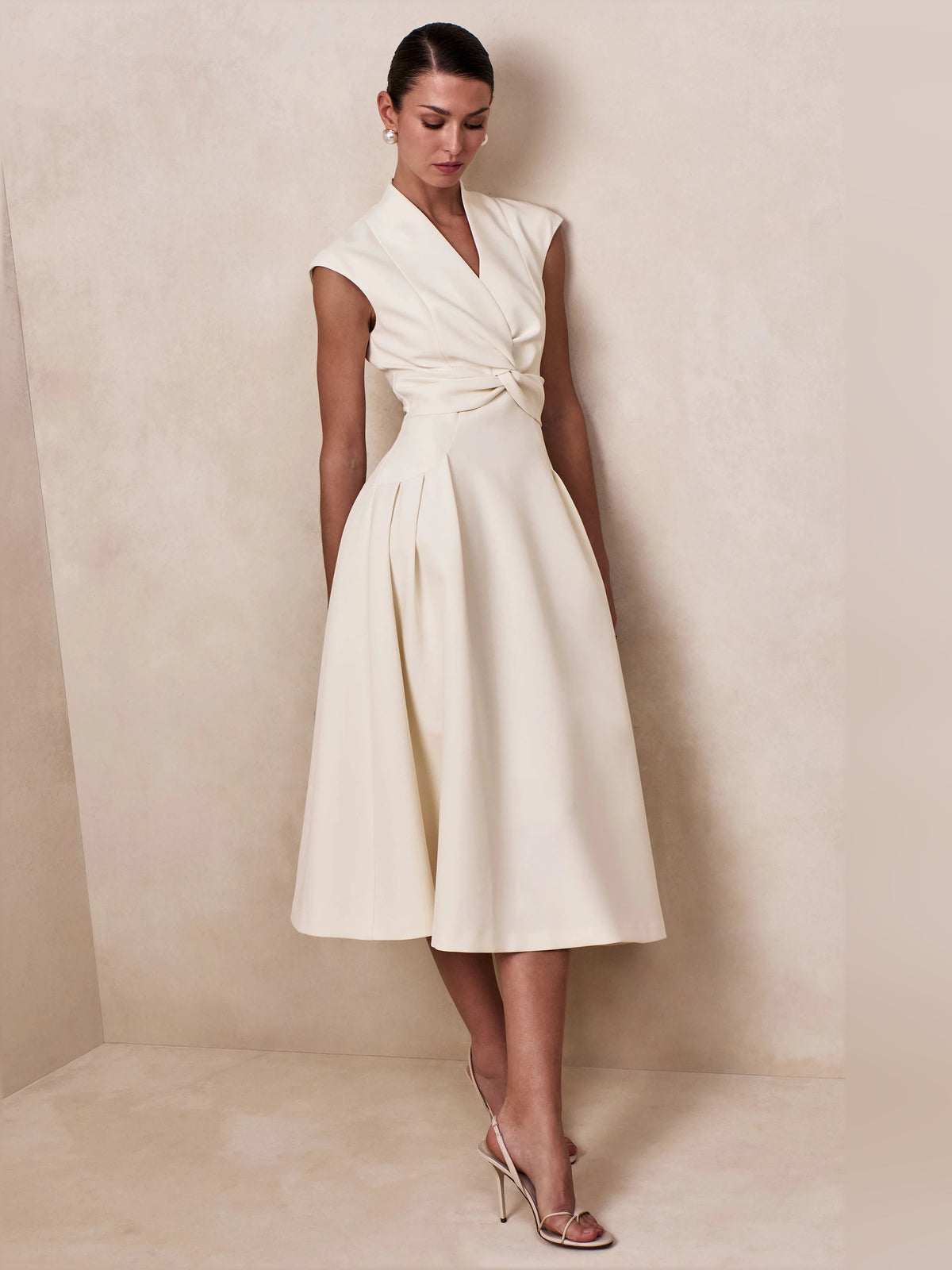 Cream V-neck sleeveless midi dress with gathered waist and pleated flare skirt