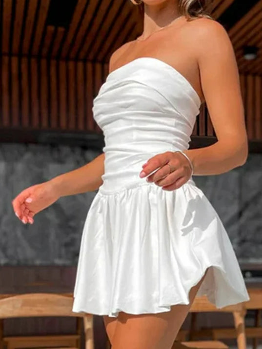 White off-shoulder mini dress with ruched bandeau bodice and gathered, flared skirt