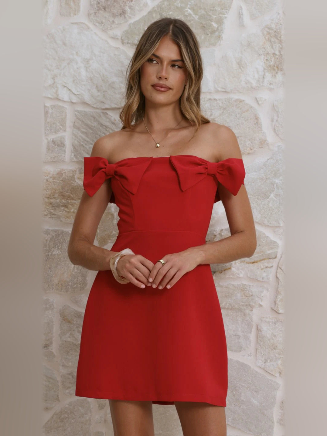 Red off-shoulder mini homecoming dress with shoulder bows and structured waist