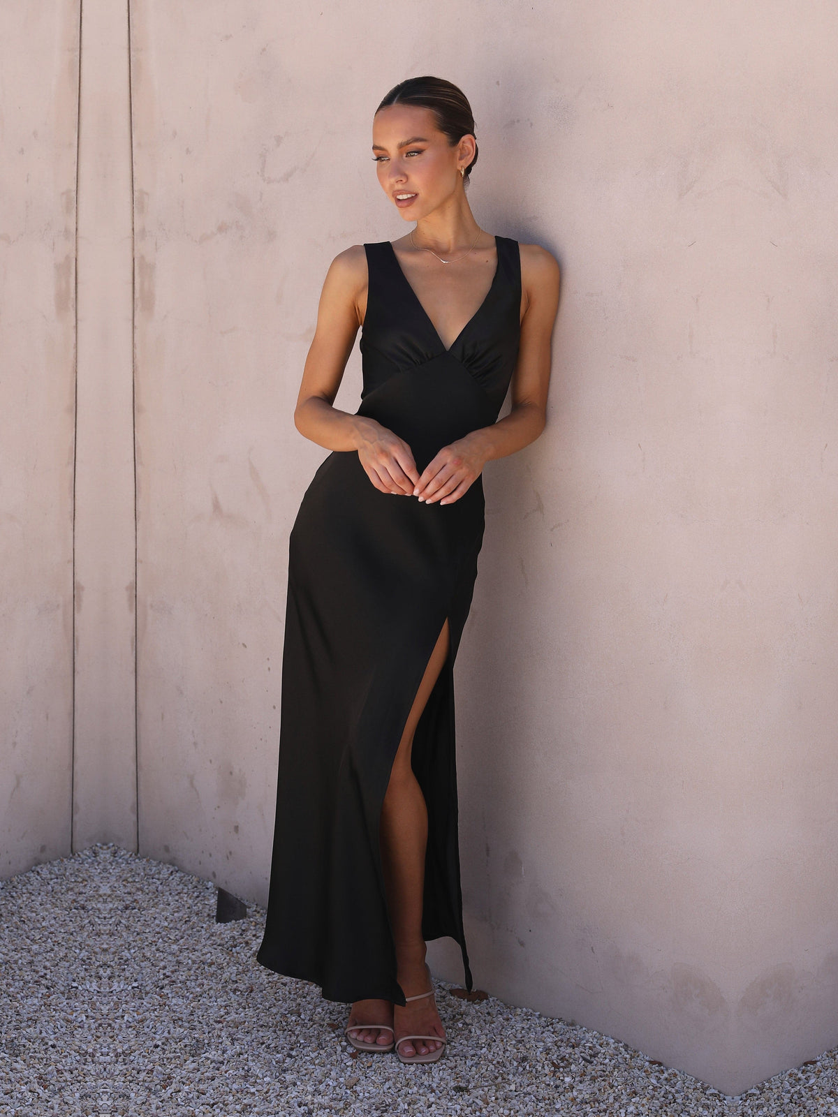 Black sheath maxi formal dress with skirt slit, alternate view showing the skirt