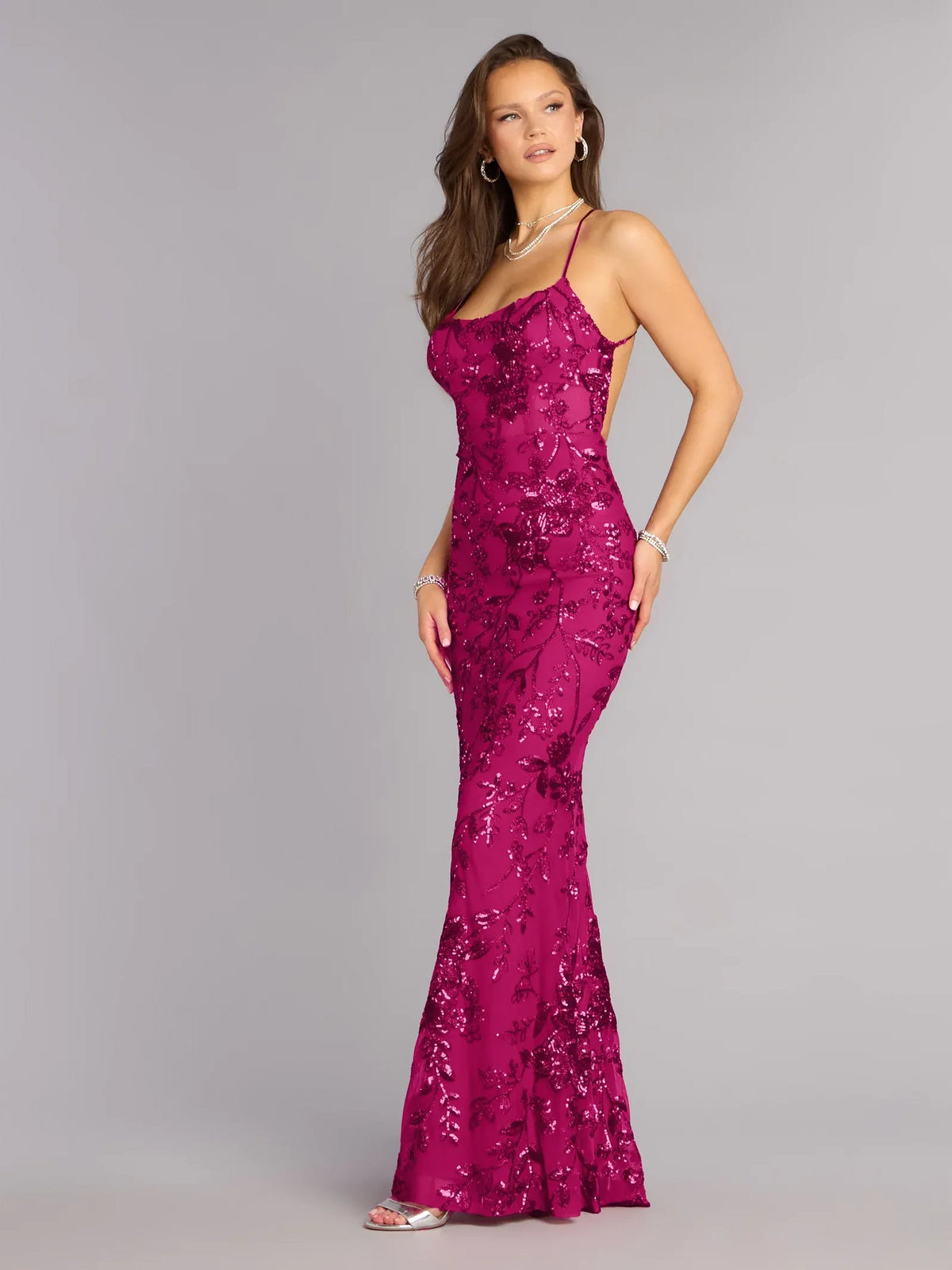 Fuchsia sequin mermaid formal dress with spaghetti straps and open back, full length