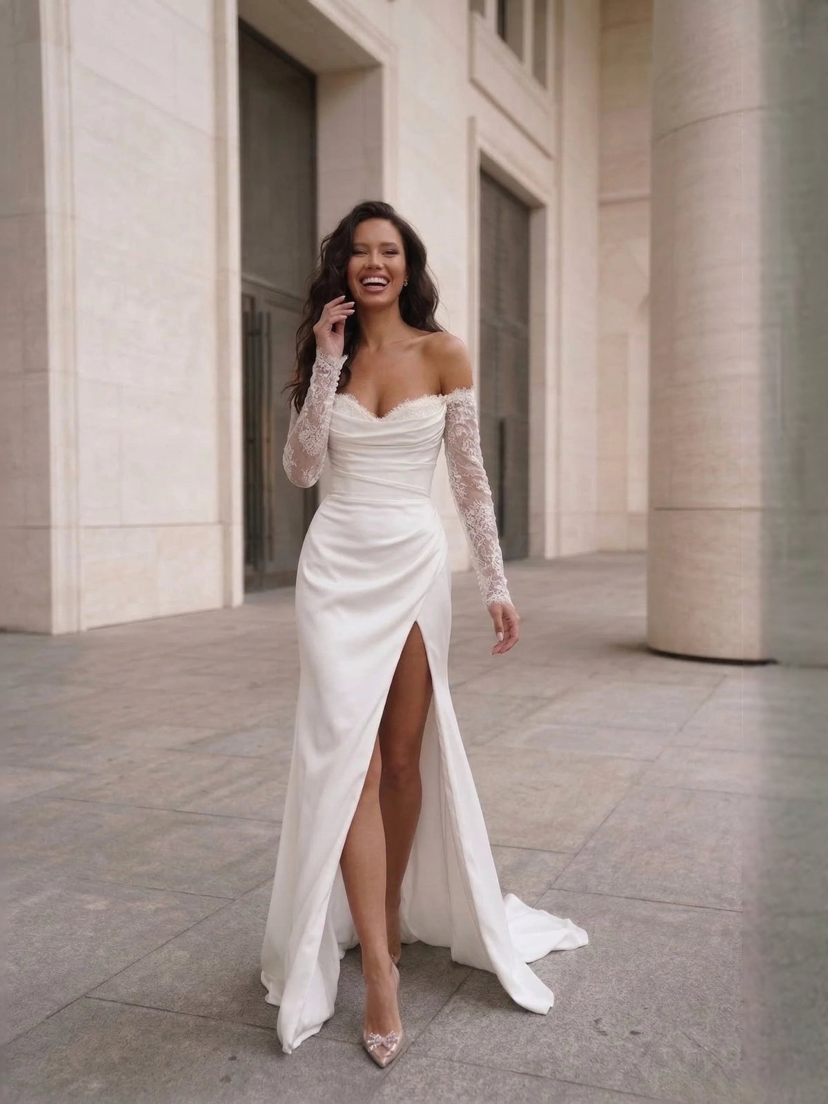Ivory sweetheart mermaid wedding dress with lace sleeves and front thigh-high slit