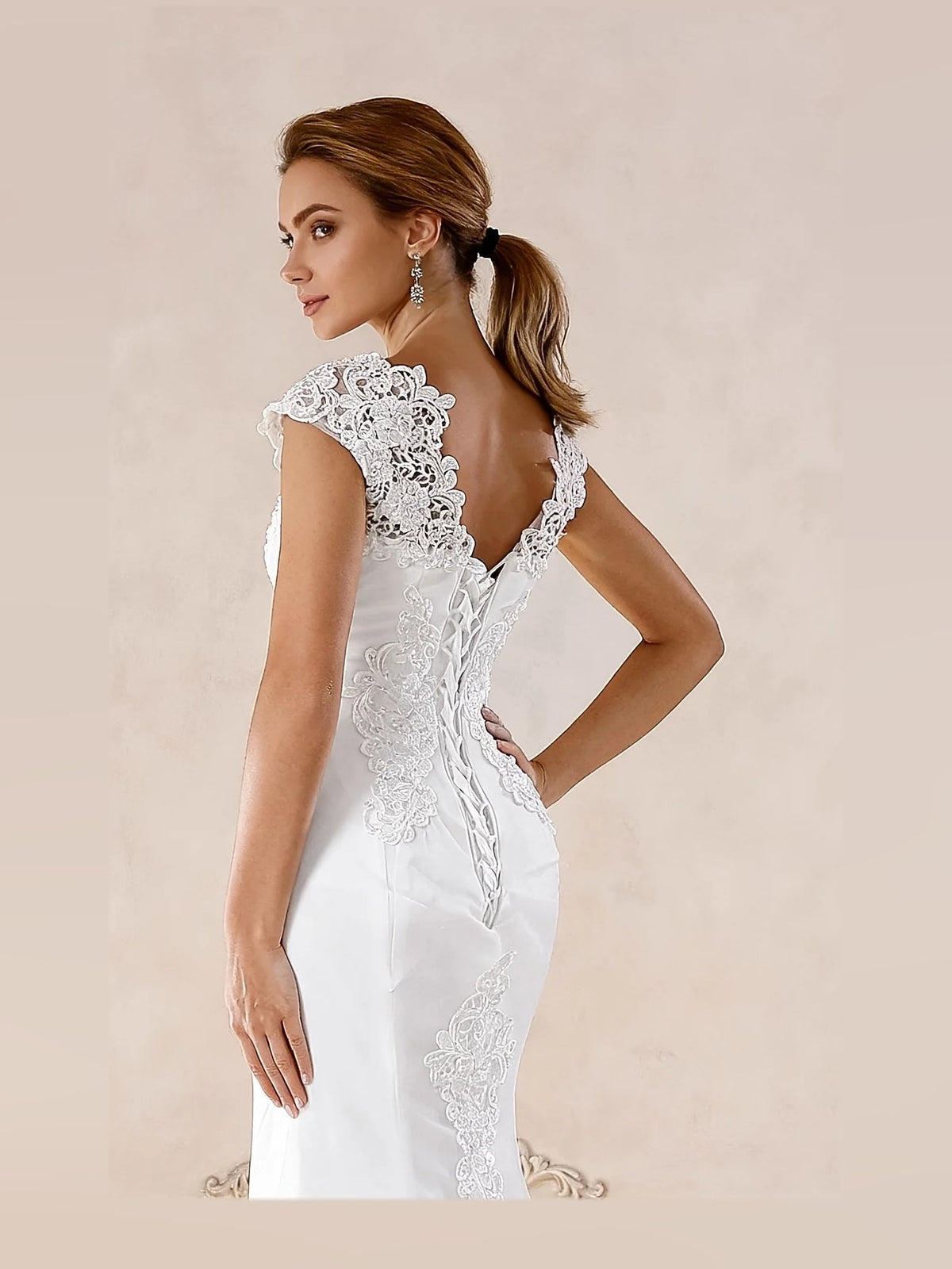 Ivory back-embellished lace mermaid wedding dress with cap sleeves and tulle train
