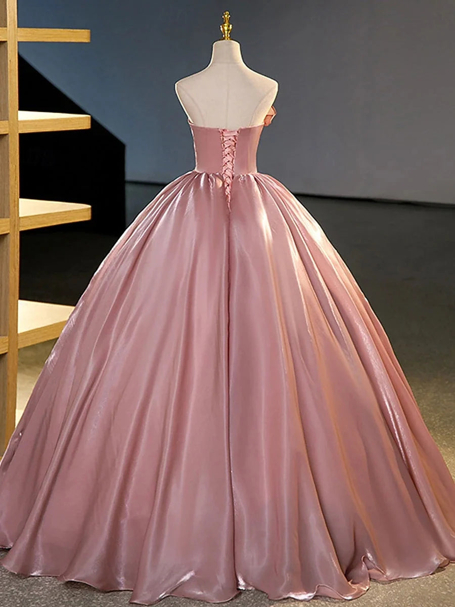 Blush pink satin corset-style bodice and gathered A-line skirt prom dress on mannequin