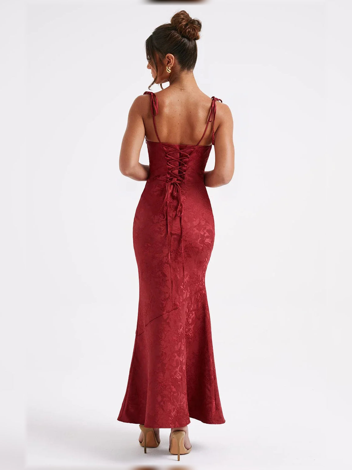 Deep red floral formal dress, back view with lace-up detail and thin straps, maxi length